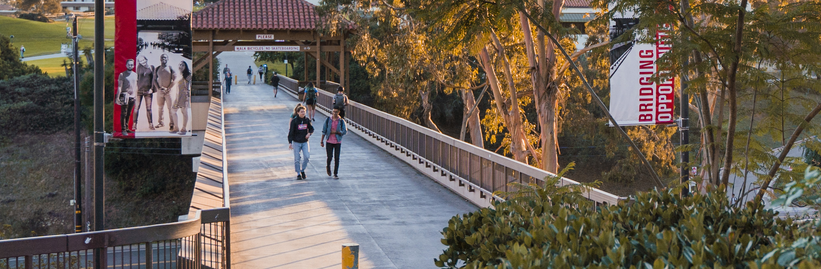 Santa Barbara City College students walking across the bridge.